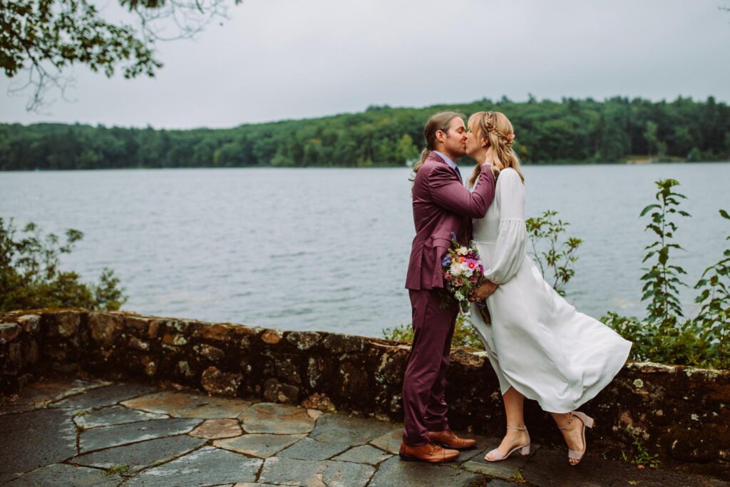 Bride and groom kissing at St Francis Church in Dublin New Hampshire