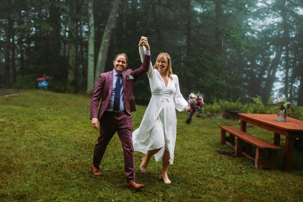 Bride and groom walk into their backyard wedding reception in Dublin New Hampshire