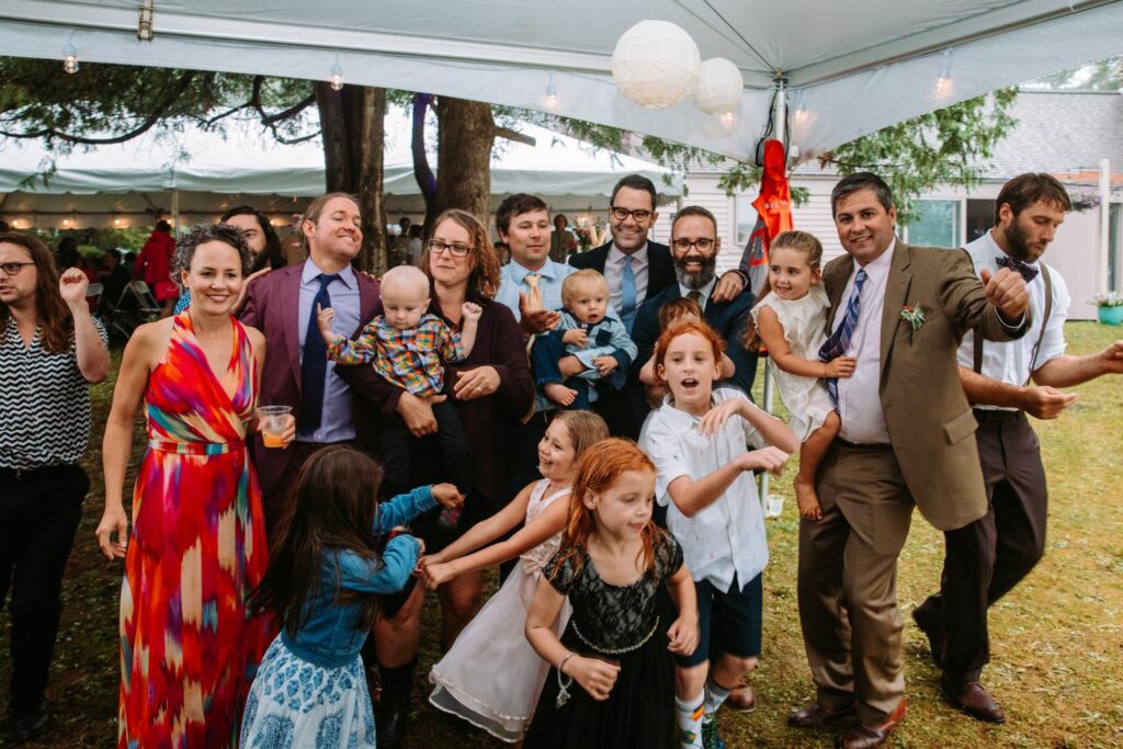 Family photo in a tent at backyard wedding in Dublin, New Hampshire