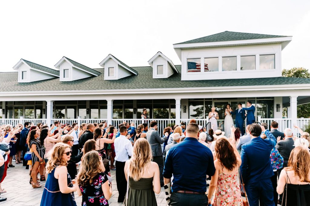 Cocktail hour on the covered porch at Chippanee Country Club wedding in Bristol Connecticut