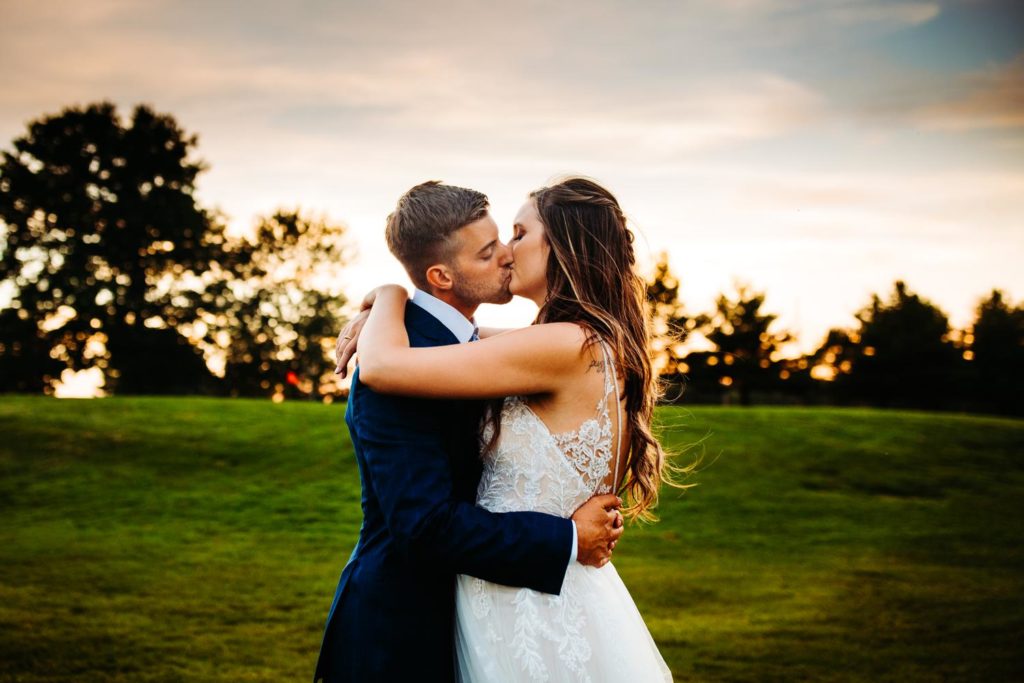 Couple portraits in golden hour light on the fields at Chippanee Country Club in Bristol Connecticut