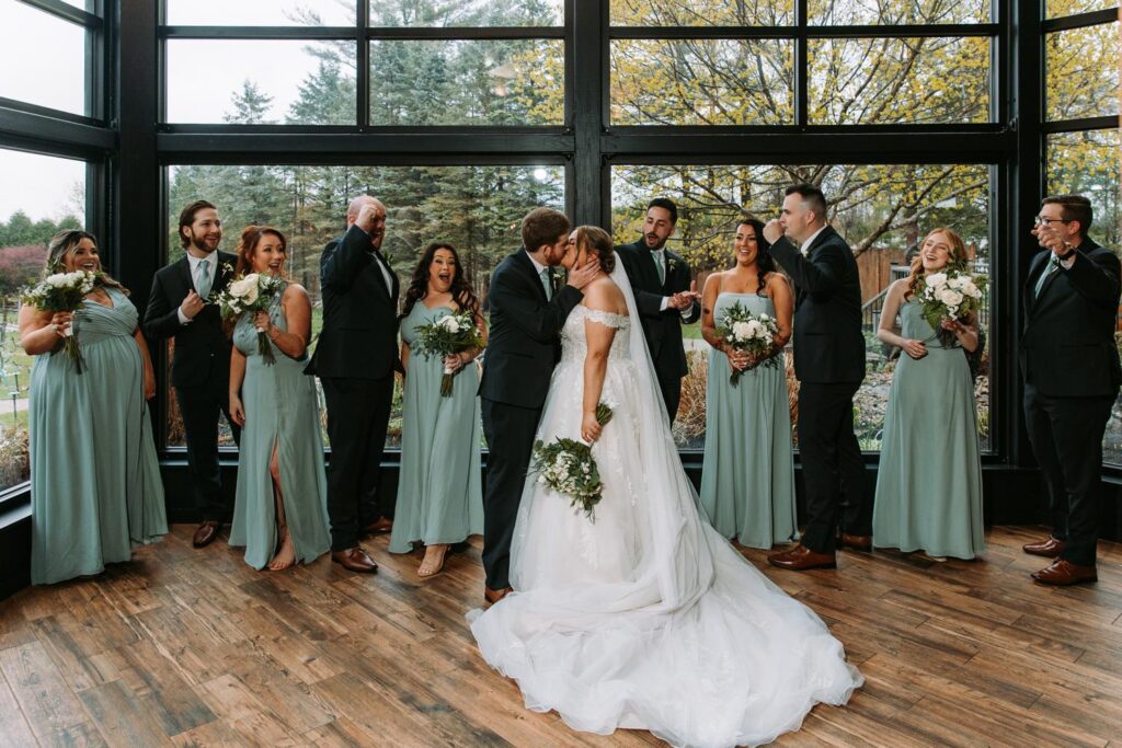 Wedding party getting organized for the ceremony with a few last-minute moments and giggles