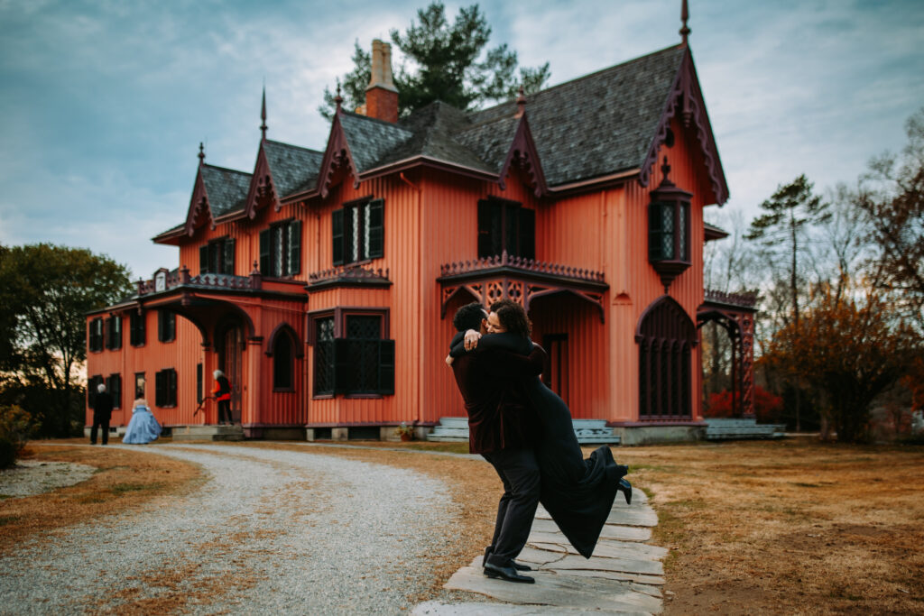 Bride and groom spin around in gothic clothes at their wedding at Roseland Cottage in Connecticut