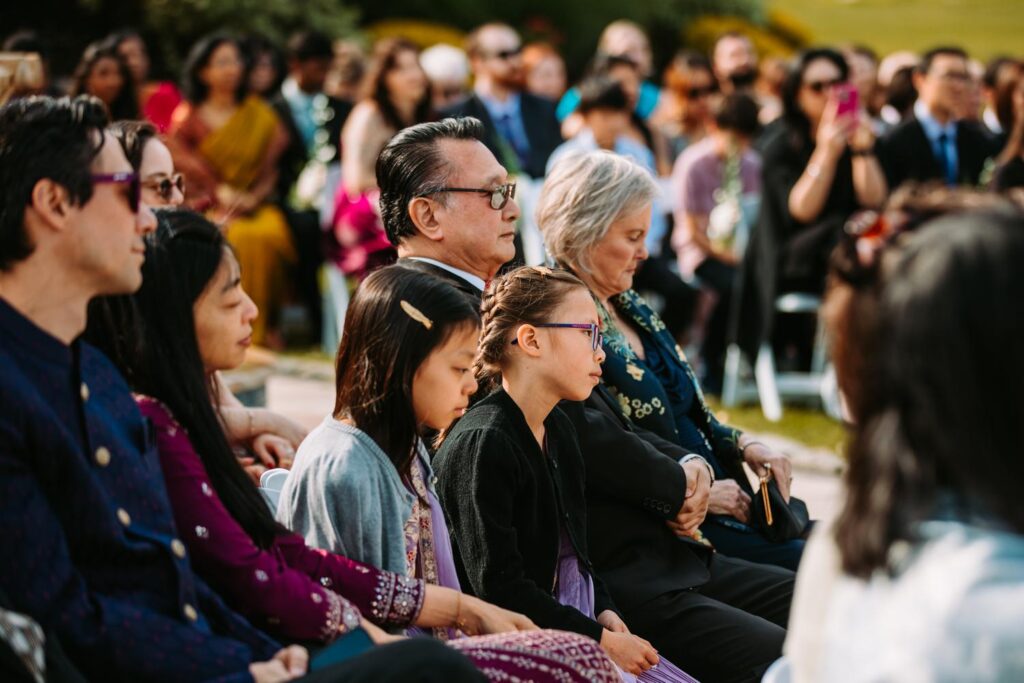 Candid of guests reacting with joy during Indian wedding ceremony at Grandview Mendon Massachusetts