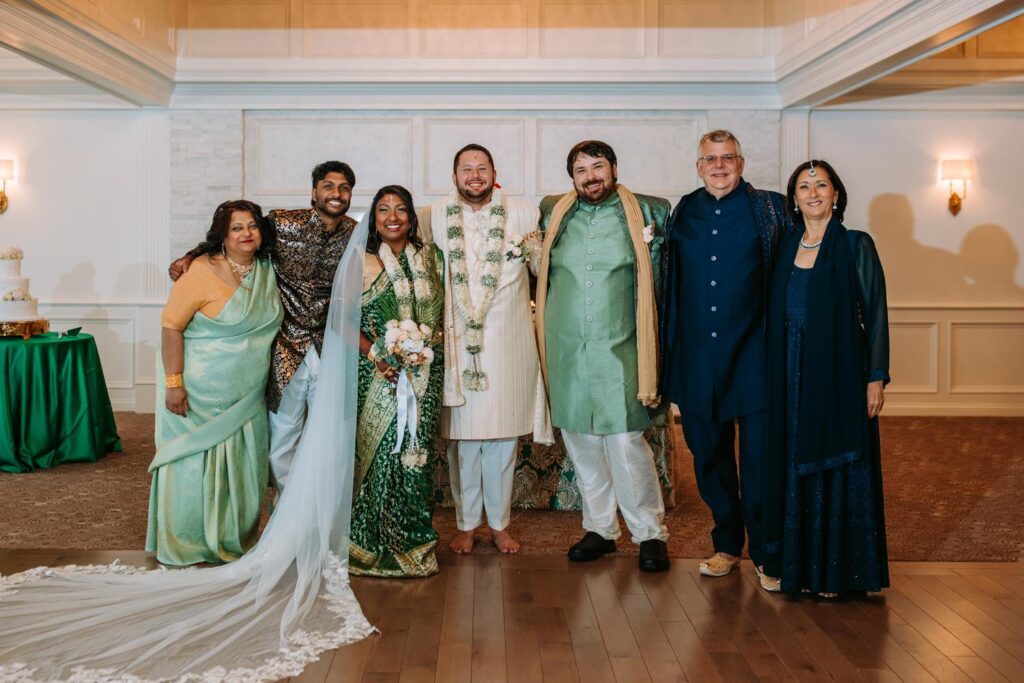 Parents smiling with newly married couple after Indian wedding at Grandview Mendon Massachusetts