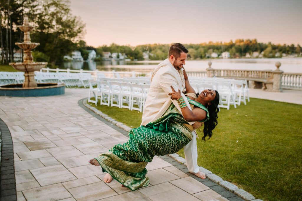 Groom holding bride close during romantic Indian wedding portraits at Grandview Mendon Massachusetts