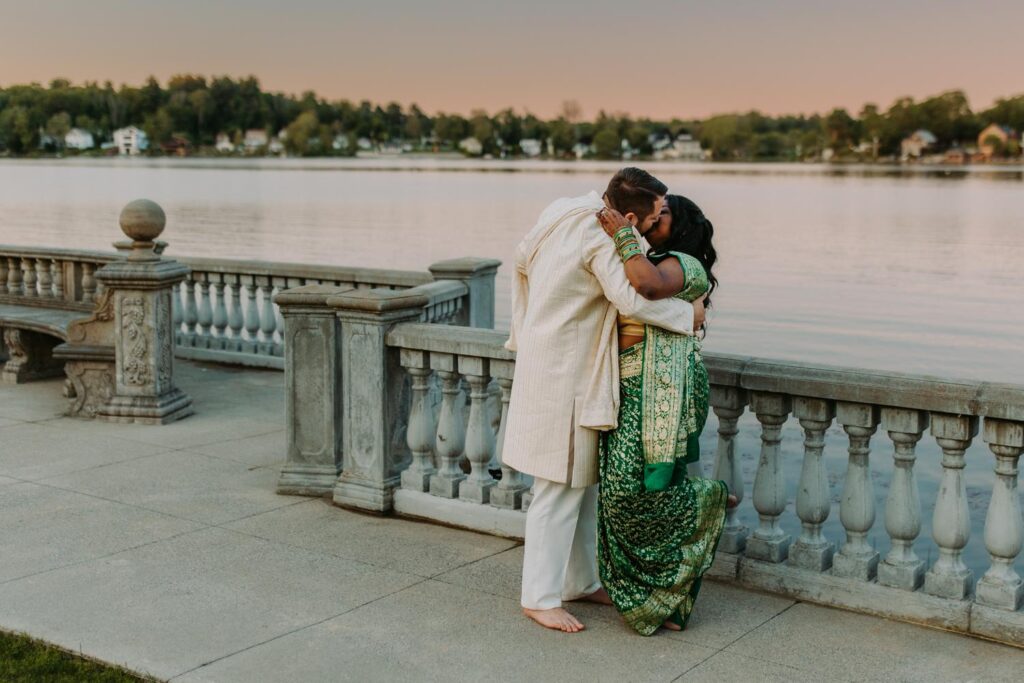 Close-up romantic embrace of bride and groom during Indian wedding portraits at Grandview Mendon Massachusett
