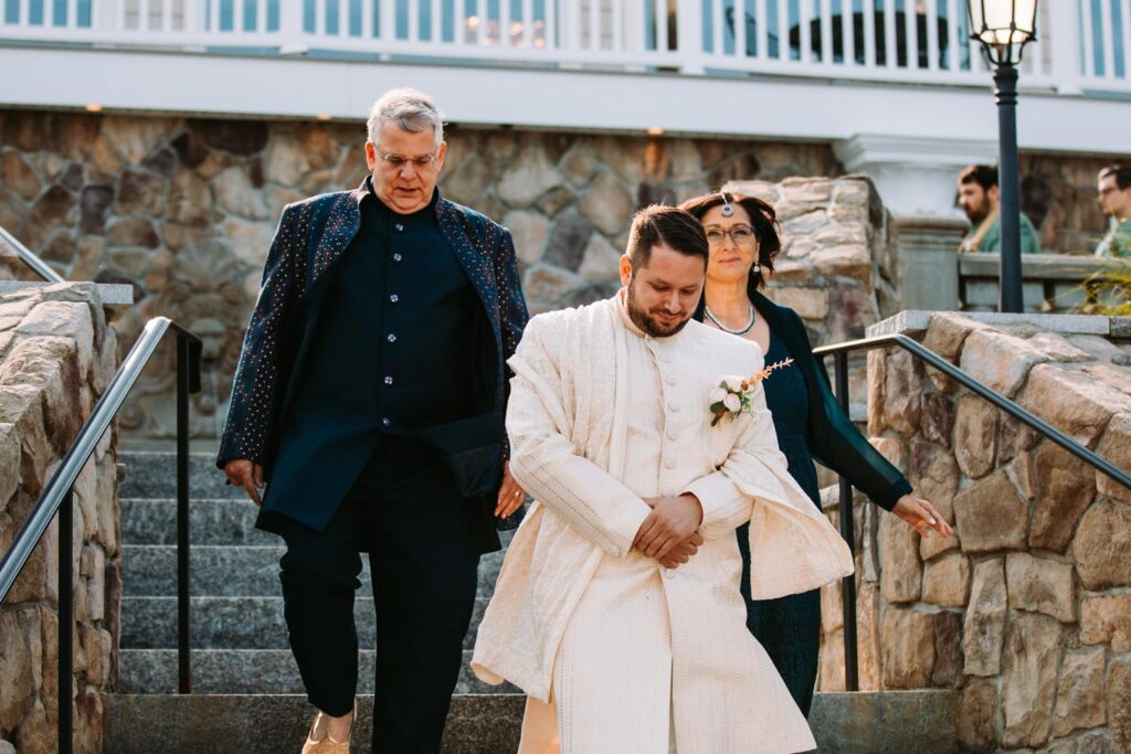 Processional with family walking down the aisle at Indian wedding ceremony at Grandview Mendon Massachusetts
