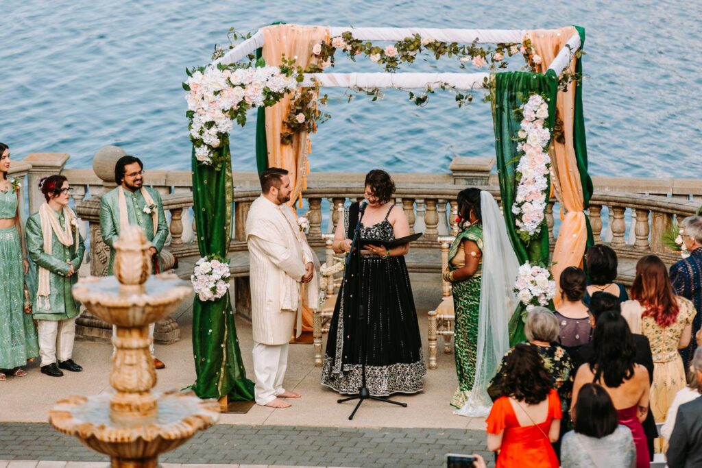 Bride and groom under mandap during traditional Indian wedding ceremony at Grandview Mendon Massachusetts.