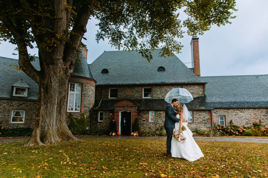 A bridge and groom kiss on their wedding day at Shepherd's Run in South Kingstown, Rhode Island