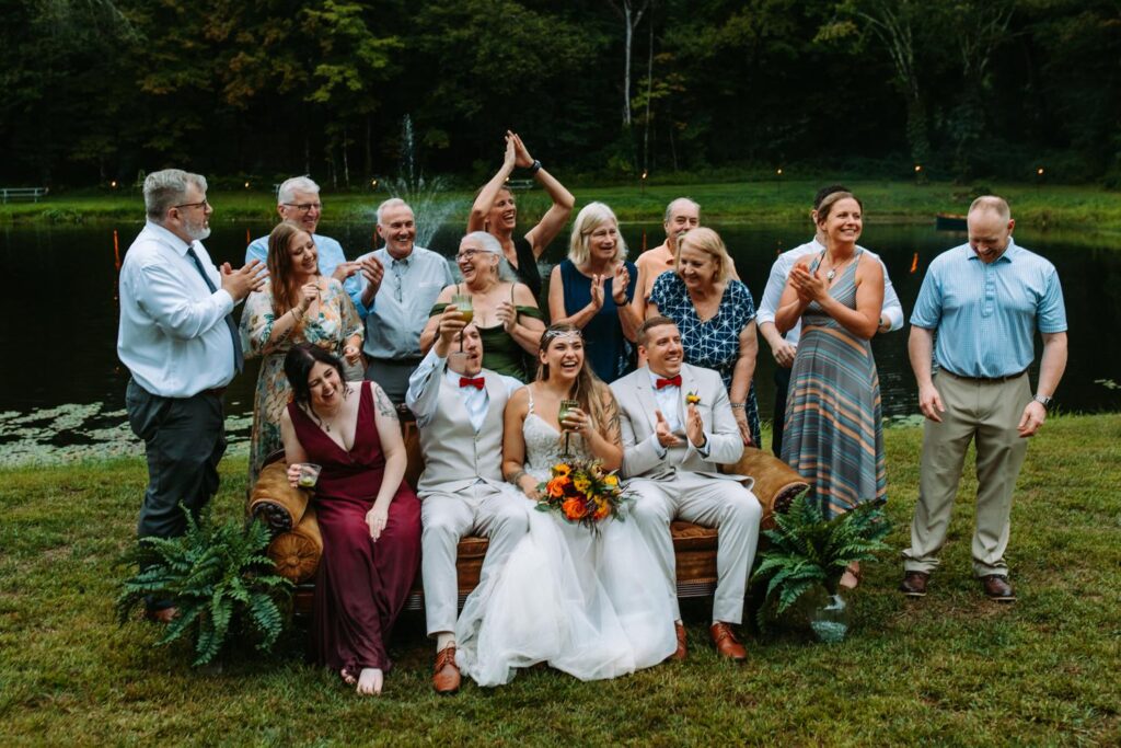 Family photos in front of a pond at a backyard wedding in Moodus, Connecticut