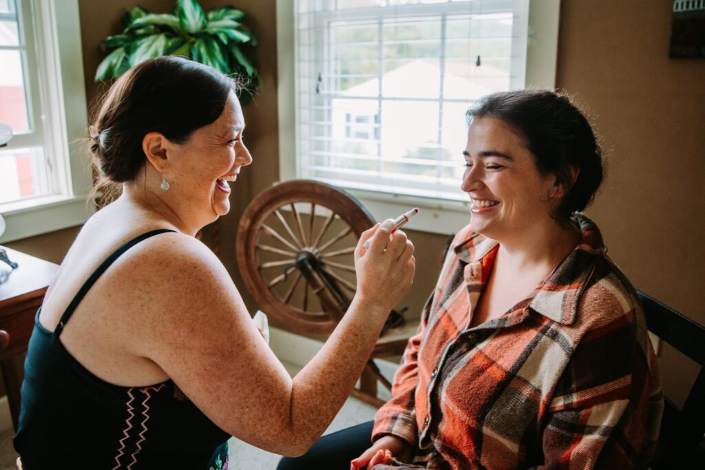 Bride getting ready in on-site cottage at The Barn on Gobeille Farm wedding in Sharon Vermont