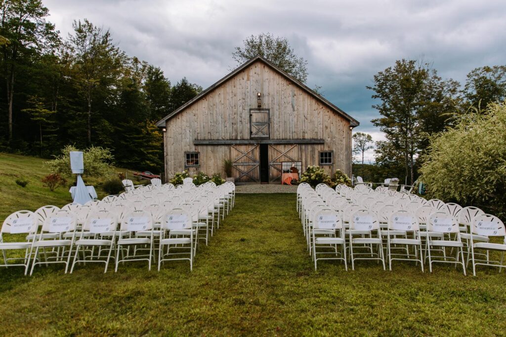 Ceremony setup with White River Valley views at The Barn on Gobeille Farm in Sharon Vermont