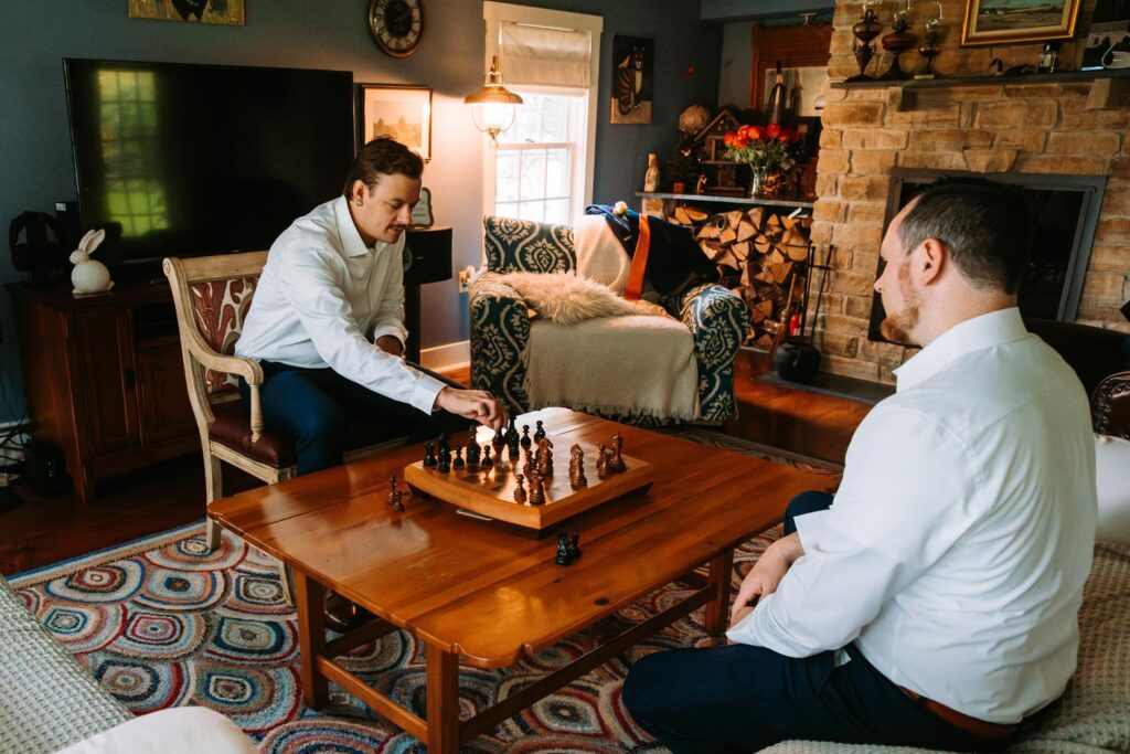 Groom getting ready in cottage at The Barn on Gobeille Farm wedding in Sharon Vermont