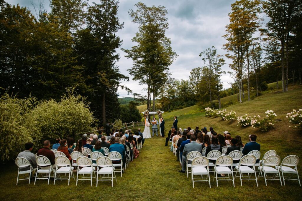 Vow exchange with Killington Mountain views at The Barn on Gobeille Farm wedding in Vermont