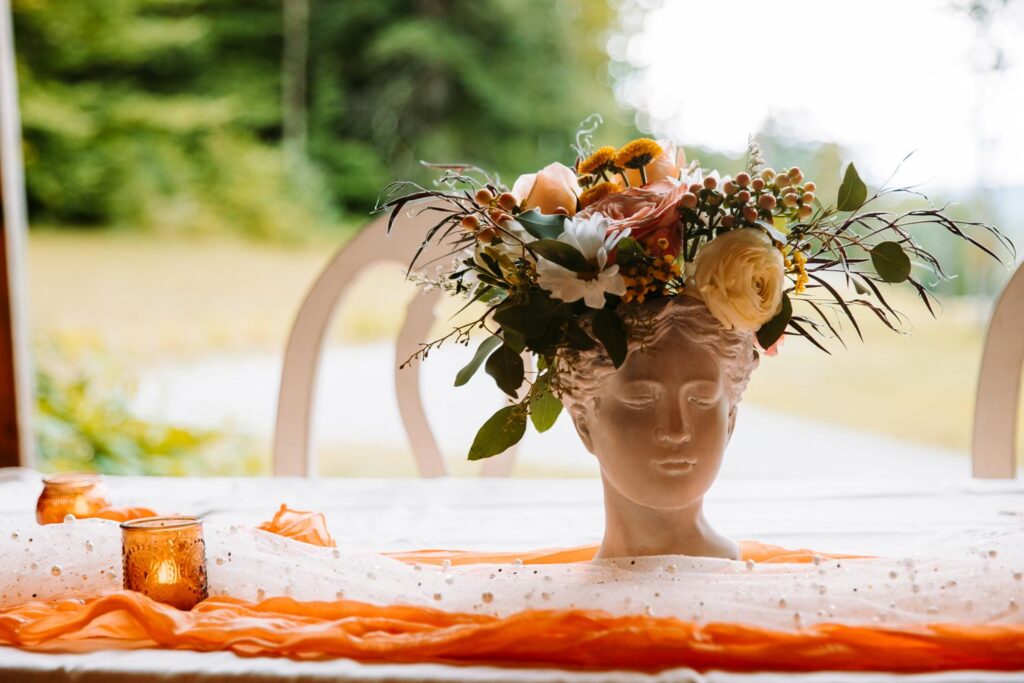 Light academia wedding reception details inside The Barn on Gobeille Farm in Sharon Vermont