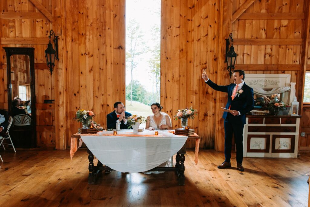 Toasts and speeches at The Barn on Gobeille Farm wedding reception in Sharon Vermont