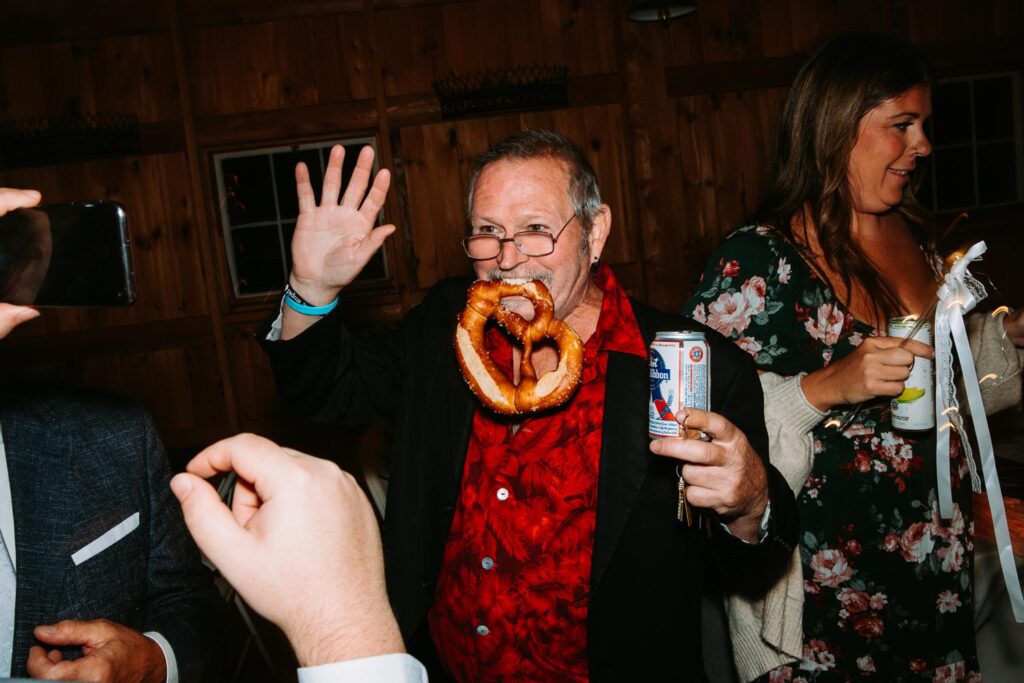 Late night giant pretzel snack at The Barn on Gobeille Farm wedding in Sharon Vermont