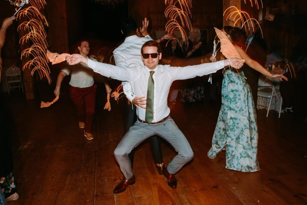 Candid dancing moments at The Barn on Gobeille Farm wedding reception in Sharon Vermont