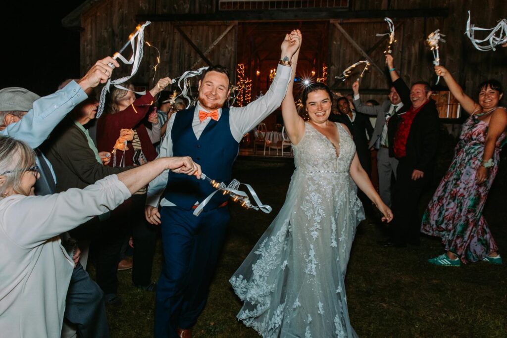 Newlyweds at end of night at The Barn on Gobeille Farm wedding in Sharon Vermont