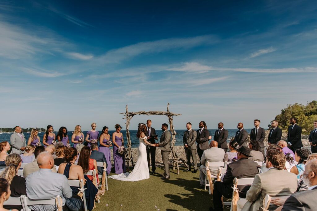 wedding ceremony on the beach stone terrace at Oceanview of Nahant in Massachusetts
