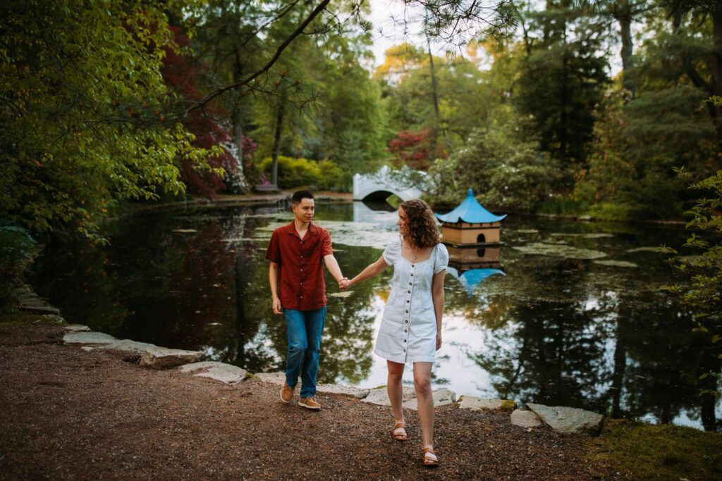 Couple walks through the Japanese Garden at Wickham Park in Manchester