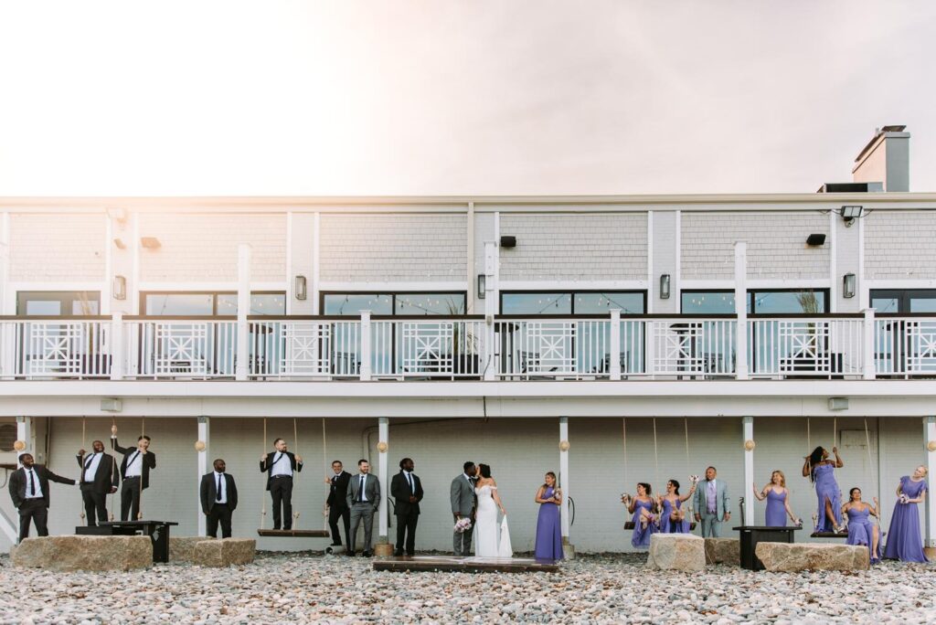 A wedding party plays on the swings at Oceanview of Nahant, a venue in Massachusetts