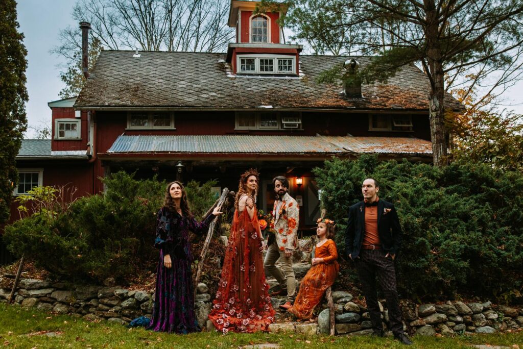 A wedding party poses at a campground wedding in the Berkshires