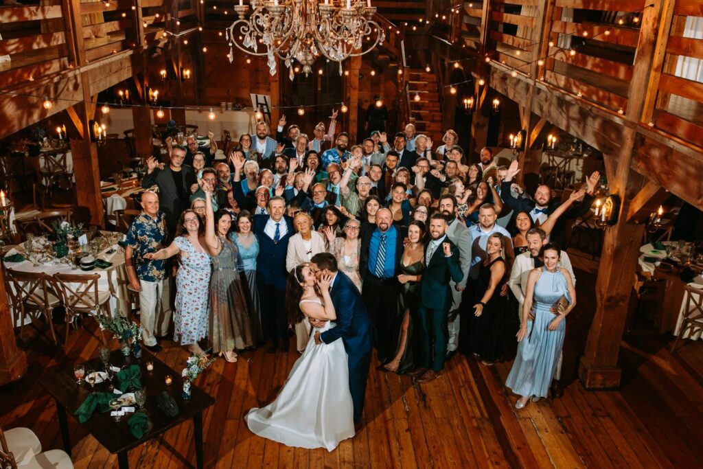 A giant group photo at a wedding in the Barn at Red Lion Inn in Cohasset, Massachusetts