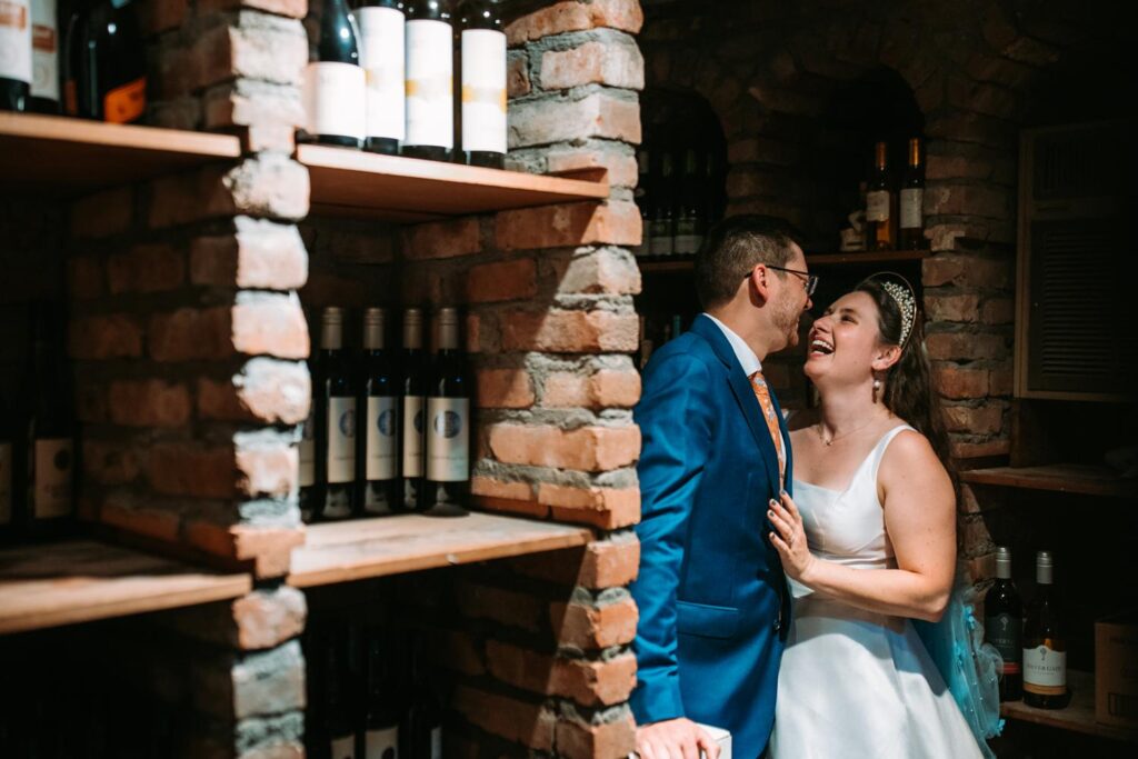 Bride and groom portraits in the wine cellar at Red Lion Inn in Cohasset, Massachusetts