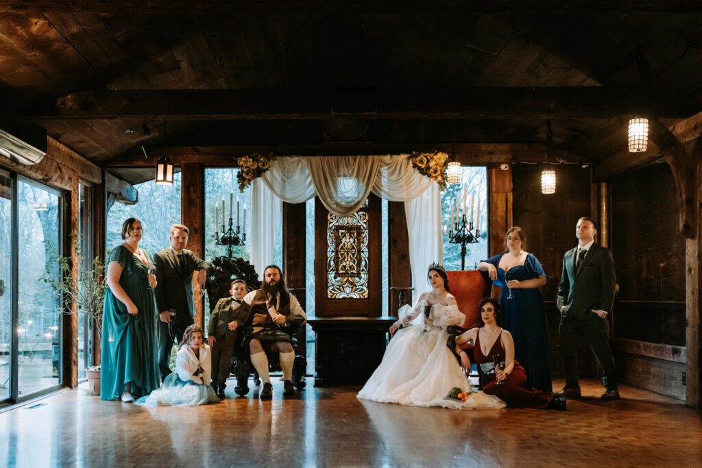 A wedding party sits in Bill Miller's Castle, dressed in medieval outfits