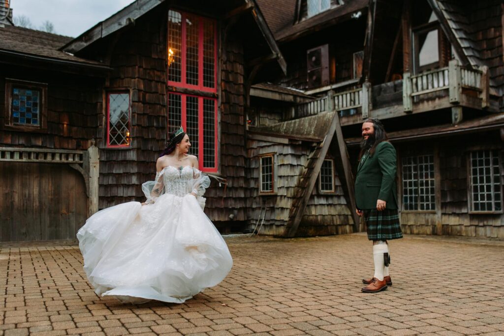 A bride and groom dance in the courtyard at their wedding at Bill Miller's Castle