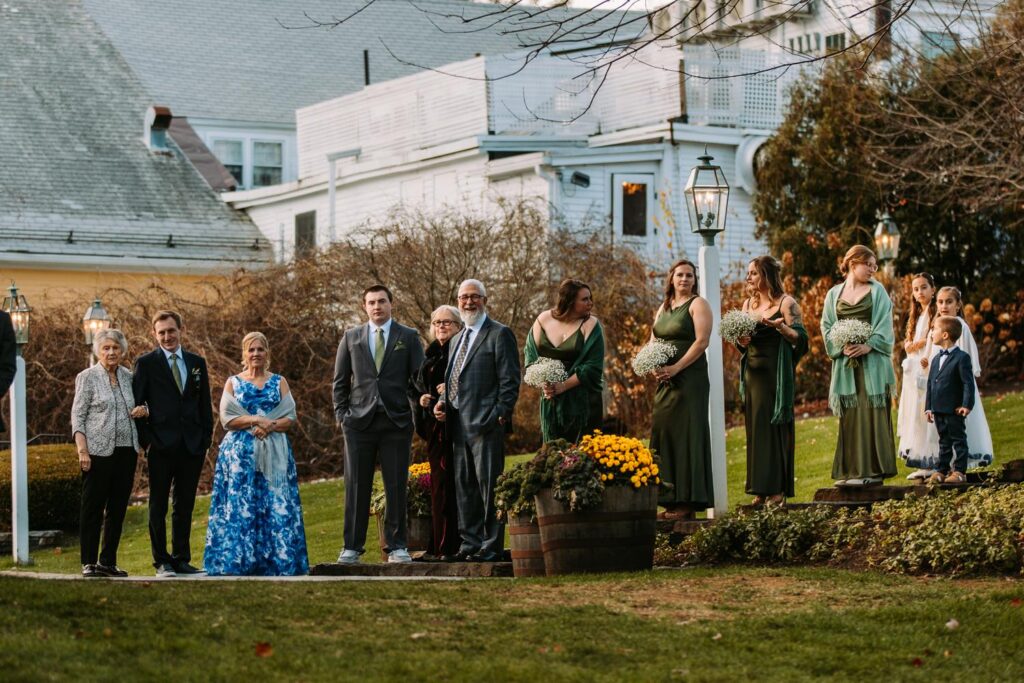 Wedding party gathered on grounds of The Publick House in Sturbridge Massachusetts