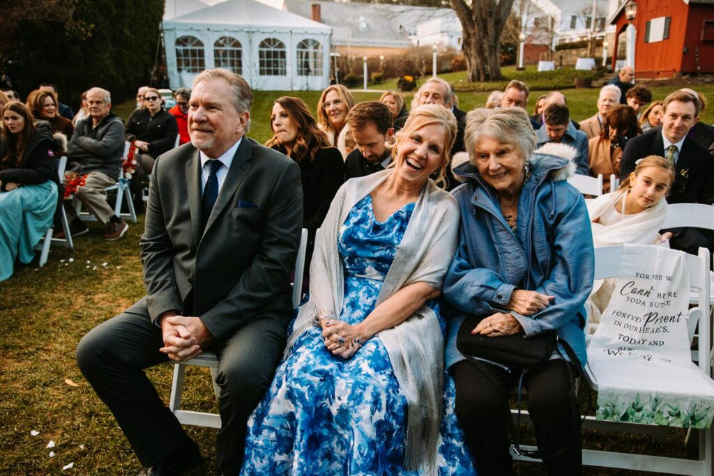 Guests laughing during ceremony at The Publick House wedding in Sturbridge Massachusetts