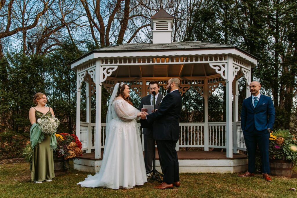 Marlee and Dominic exchanging vows at gazebo at The Publick House wedding in Sturbridge Massachusetts