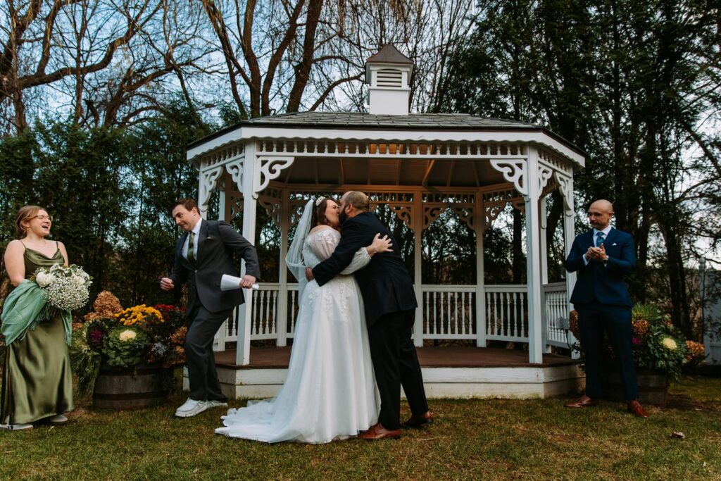 Marlee and Dominic first kiss at gazebo ceremony at The Publick House in Sturbridge Massachusetts