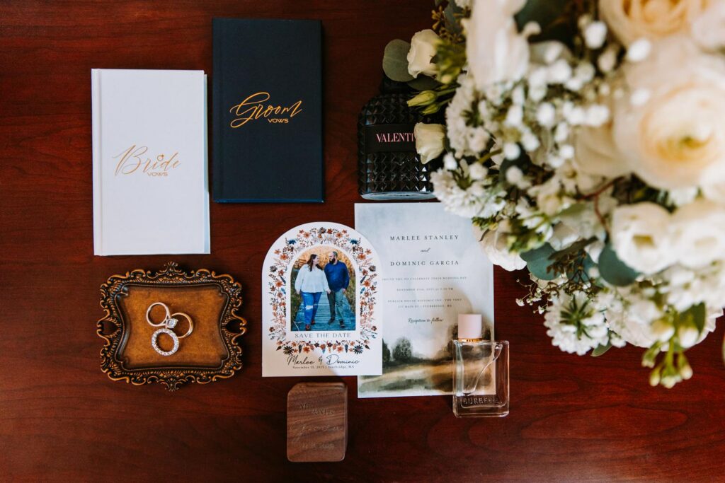 Wedding details flat lay with invitation suite and rings at The Publick House wedding in Sturbridge Massachusetts