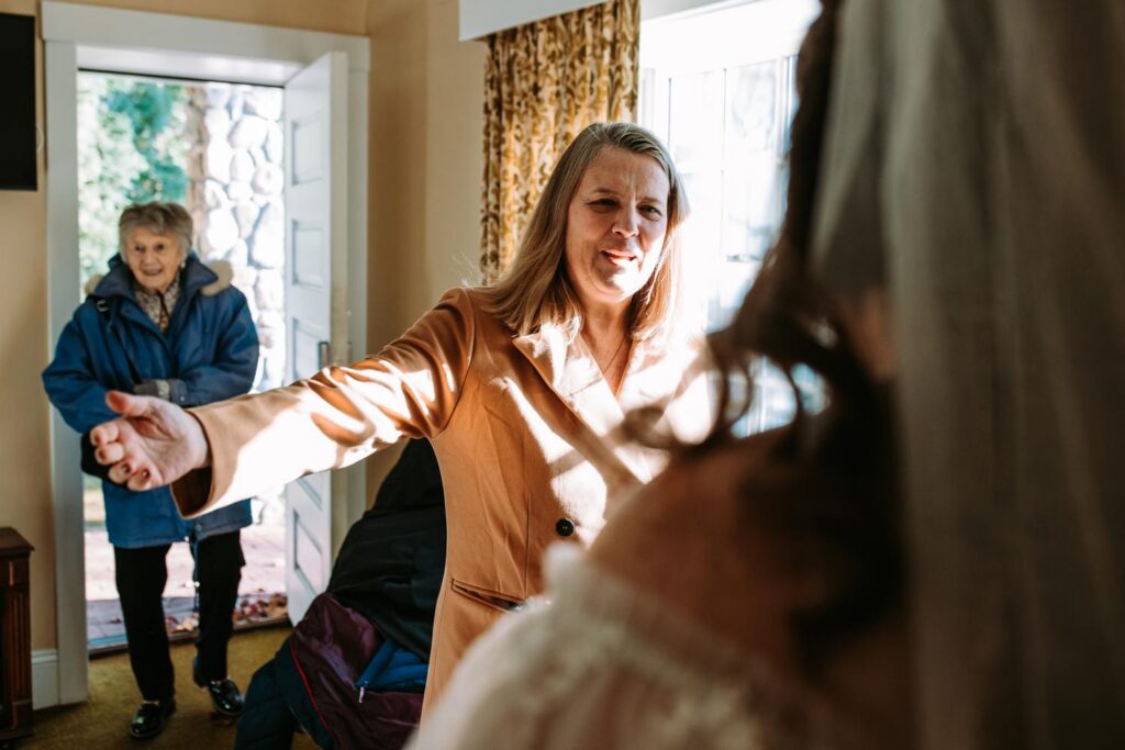 Marlee hugging family at The Publick House wedding in Sturbridge Massachusetts