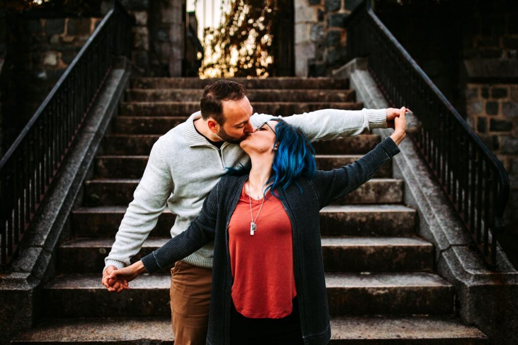 Couple playfully interacts during their engagement photos at the Cumberland Public Library in Rhode Island
