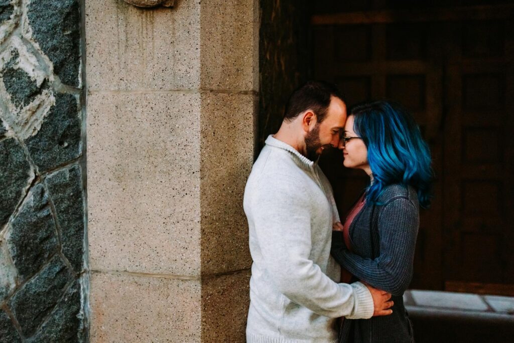 Cuddling up during engagement session at Cumberland Library in Rhode Island