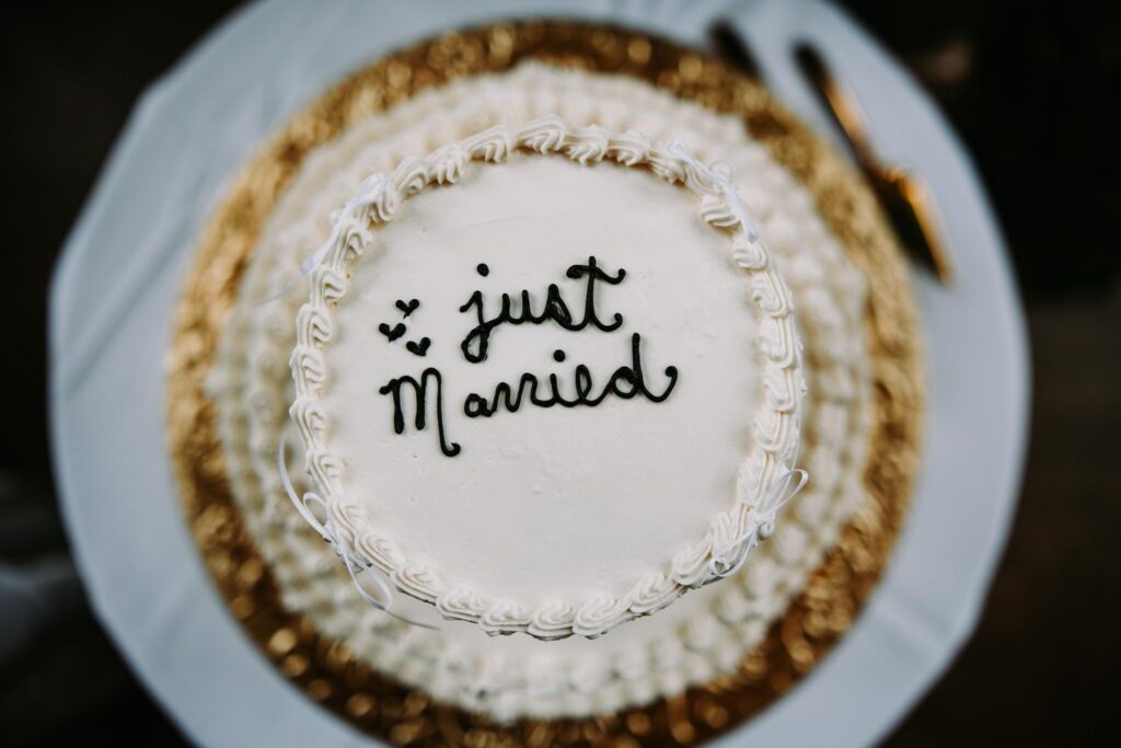 Just married cake with script lettering and gold detail, Pond House Cafe wedding reception