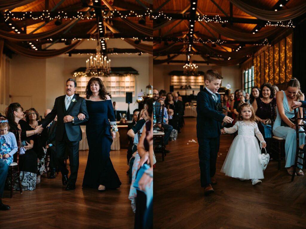 Wide shot of Pond House Cafe reception room filled with guests, warm chandelier lighting