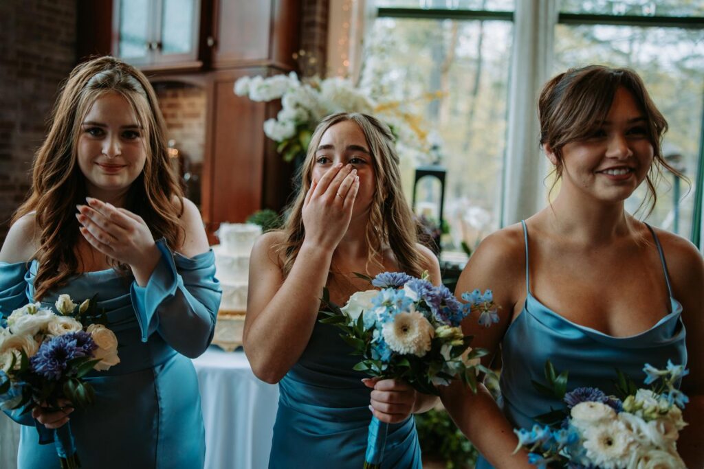 Bridesmaid wiping tears during emotional wedding ceremony, Pond House West Hartford