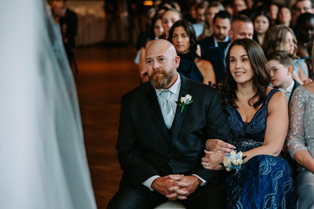 Father of the bride watching ceremony with proud emotional expression, Pond House wedding