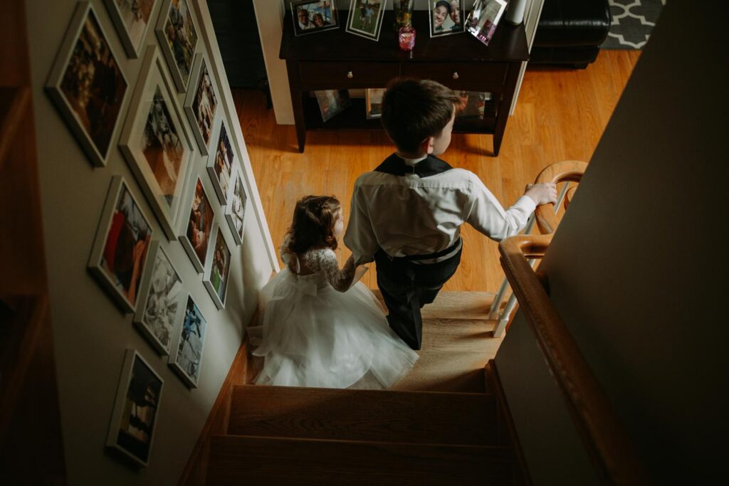 Overhead shot of flowergirl and ringbearer on stairs