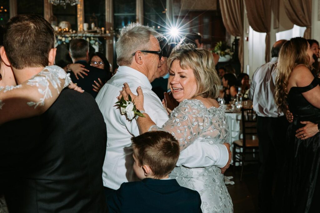 Grandparents slow dancing at Pond House Cafe wedding reception