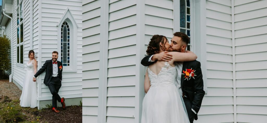 Bride and groom sharing a kiss outside the white church, bright May day, Bluebird Farm wedding