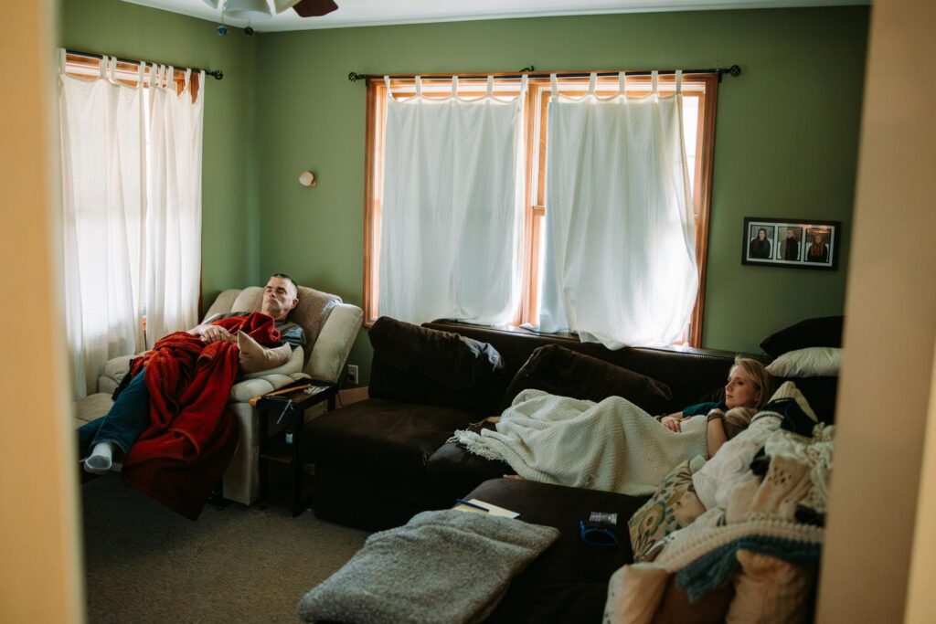 Candid getting ready moment, dad and sister relaxing in a cozy room before the Bluebird Farm wedding ceremony
