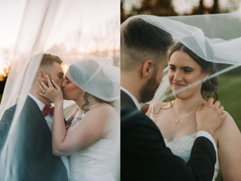 Under the veil portrait of bride and groom kissing in the field, soft golden light