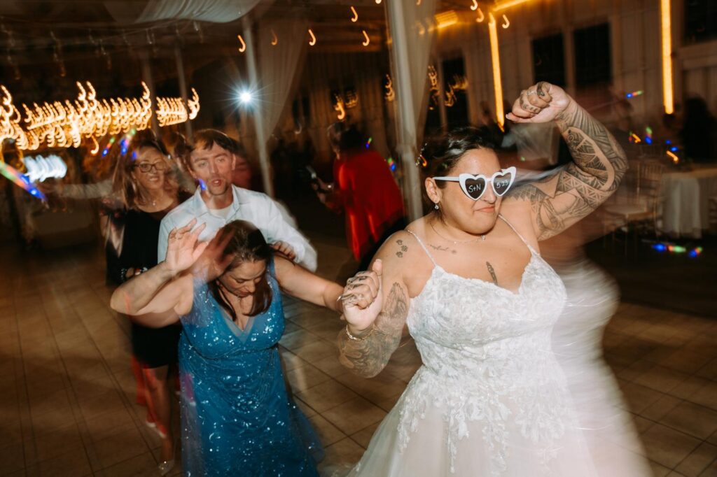 Nicole dancing with guests on the late night Lighthouse Point Park dance floor, pure joy and movement
